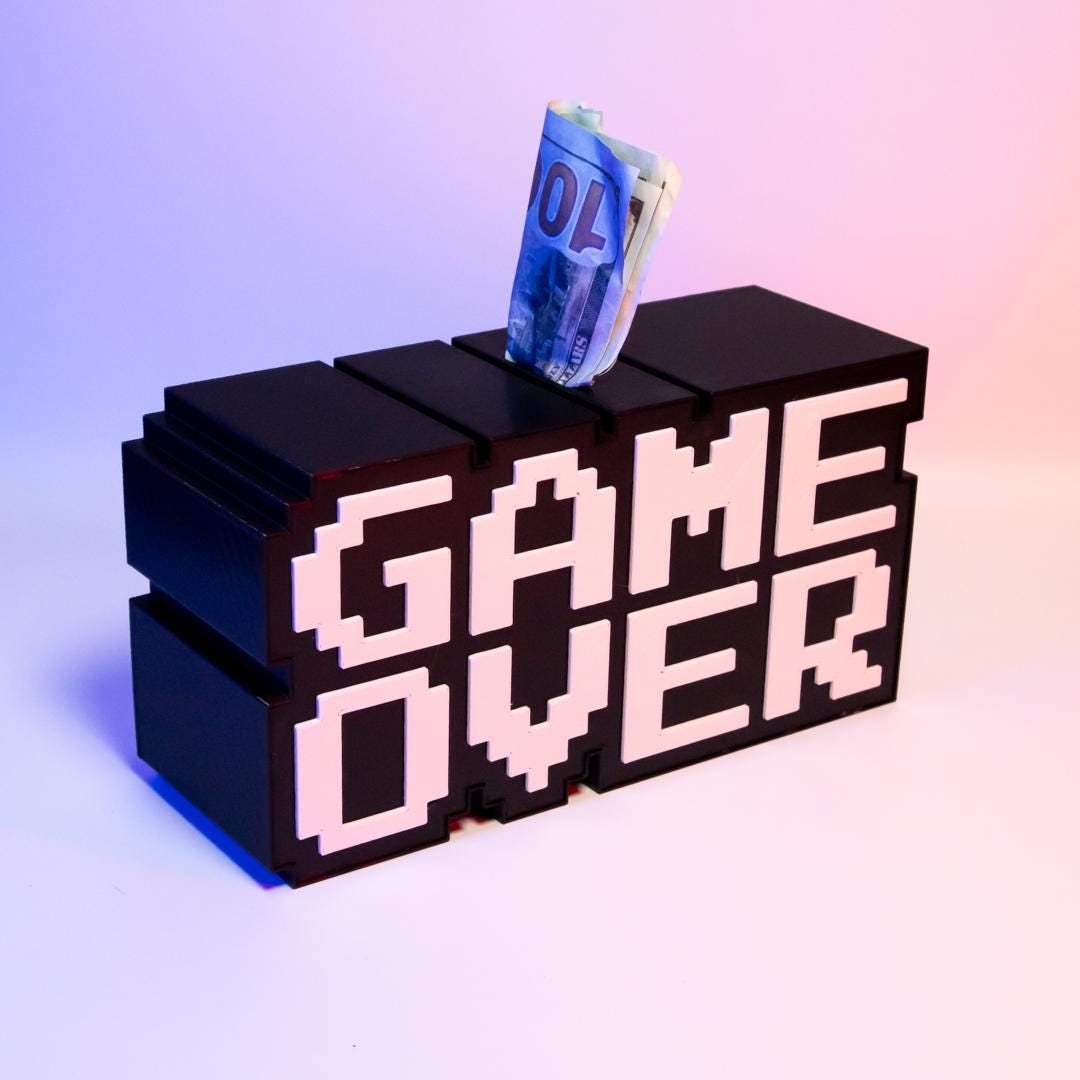 Game Over Piggy Bank Fun Gaming-Themed Savings Bank Unique Desk Decor Perfect Gift for Gamers Retro Arcade Style Coin Bank